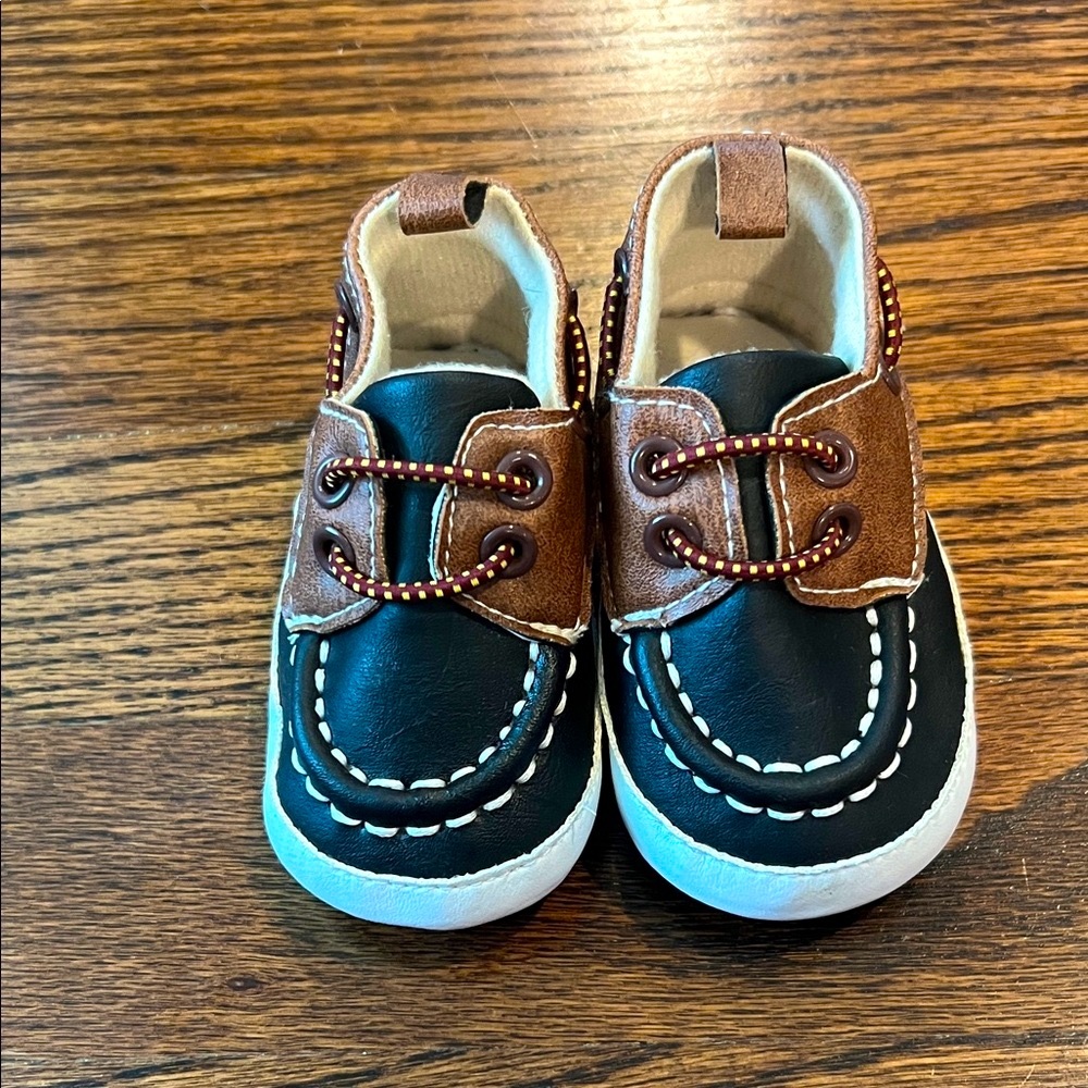 Rising Star Black and Tan Baby Moccasins